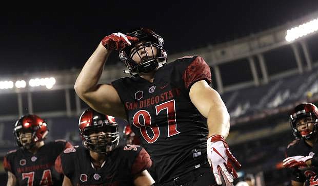 San Diego State tight end Kahale Warring, center, reacts after scoring a two-point conversion during the second half of Saturday&#039;s game against Arizona State in San Diego.
