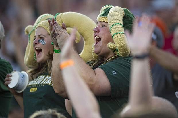 Colorado State fans cheer after an Arkansas turnover during Saturday&#039;s game in Fort Collins, Colorado. The Rams upset the Razorbacks, 34-27.