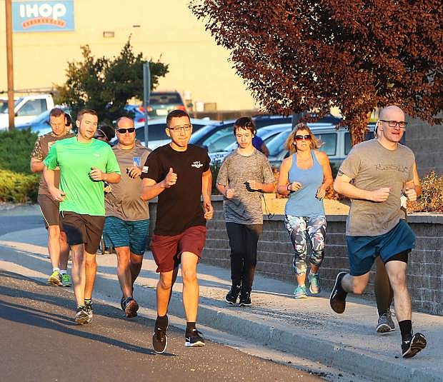 Runners leave the Carson City IHOP Thursday during the annual memorial run.