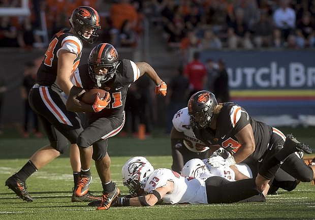 Oregon State&#039;s Artavis Pierce carries the ball against Southern Utah on Saturday in Corvallis, Ore. The Beavers will visit Nevada this Saturday.