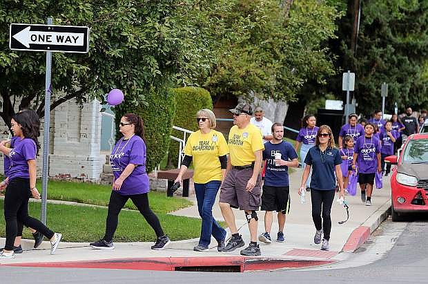 Nearly 100 people participate in the fourth annual 5K Walk for Suicide Prevention in Carson City on Sept. 15.