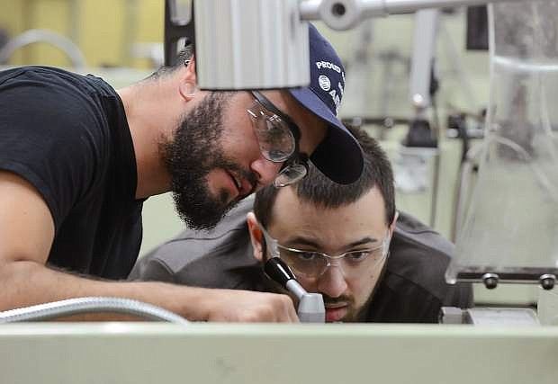 Humberto Vera, left, and John-Michael Juneau work in a machine tool class at Western Nevada College in Carson City on Sept. 27, 2017.