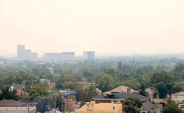Smoke fills the Sierra sky at about 1 p.m. Tuesday, July 31, while looking south from downtown Reno toward the Peppermill and Atlantis casinos.
