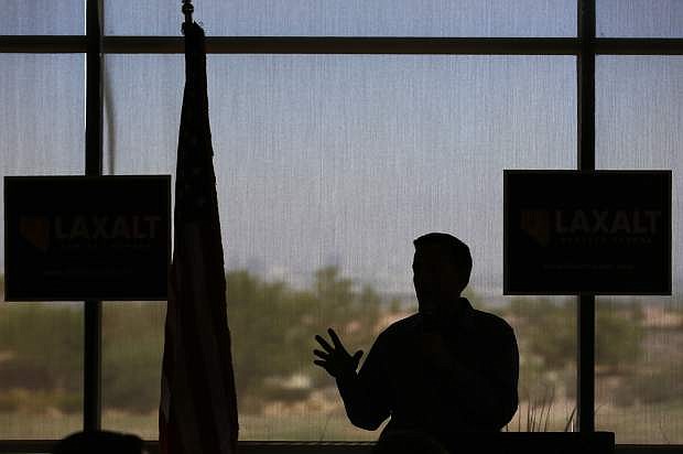 In this Aug. 28, 2018, photo Nevada state Attorney General Adam Laxalt speaks at a campaign event in Henderson, Nev. In the Nevada Governor&#039;s race, Laxalt has frequently included anti-California messages in campaign appearances and statements.(AP Photo/John Locher)