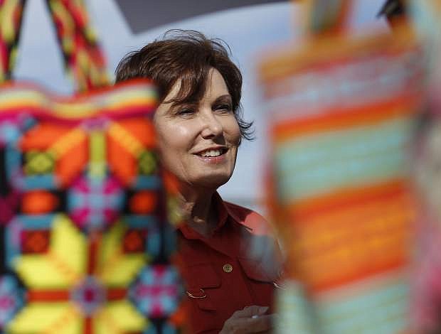Rep. Jacky Rosen, D-Nev., speaks with vendors at a festival in North Las Vegas on May 5.