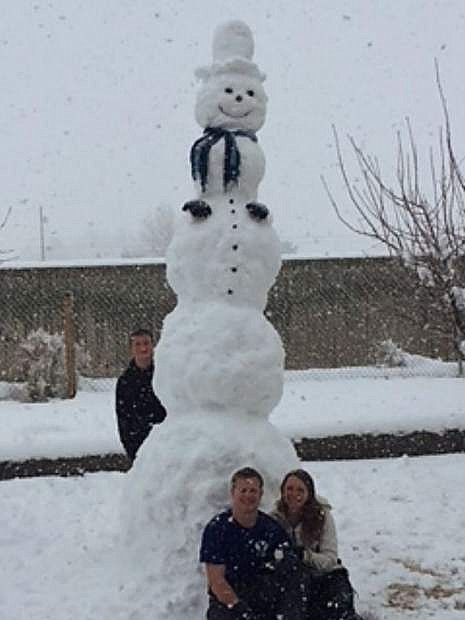Dallin, Austin and Kendall Shaffer spent their snowday erecting a massive snowman Friday in Carson City.