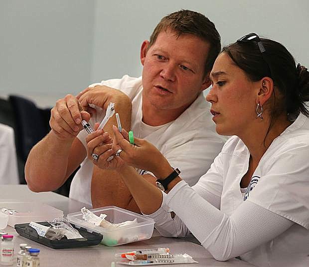 Joseph Yeargan and Niki Perry work in a nursing class at Western Nevada College on Sept. 19, 2017.