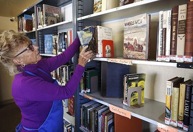 Volunteer Patti May works in the Nevada and the West section of the Browsers Corner Book Store in Carson City, Nev., on Monday, Oct. 22, 2018. Photo by Cathleen Allison/Nevada Momentum