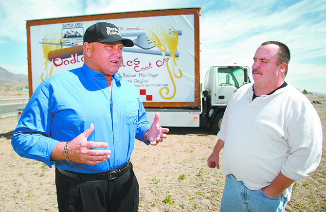 Published Caption: Cathleen Allison/Nevada Appeal
Dennis Hof, left, talks Tuesday about using his new billboard truck to promote local community events. John Stevens, chair of the Oodles of Noodles Cook Off in Dayton, right, said the publicity from the truck has been helpful.  
Photographer&#039;s Caption: Cathleen Allison/Nevada Appeal
Dennis Hof, left, talks Tuesday about using his new billboard truck to promote local community events. John Stevens, chair of the Oodles of Noodles Cook-Off in Dayton, right, said the publicity from the truck has been helpful.