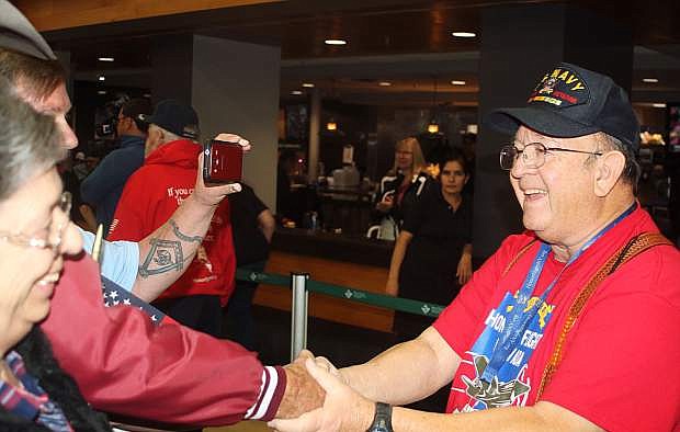 Paul Ortiz of Fallon shakes hands with friends at the Reno-Tahoe International Airport.