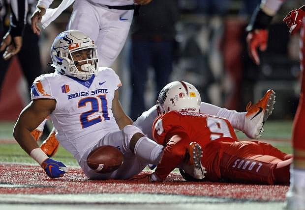 Boise State running back Andrew Van Buren scores a touchdown against New Mexico safety Stanley Barnwell during the second half in Albuquerque, N.M., on Friday. Boise State won, 45-14.