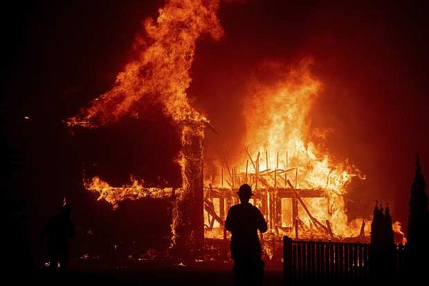 A home burns as the Camp Fire rages through Paradise, Calif., on Nov. 8.