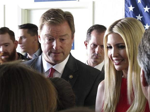 Ivanka Trump, President Trump&#039;s daughter and advisor, and Nevada Republican Sen. Dean Heller talk to supporters after their speeches at the GOP field office in Reno, Nev., Thursday, Nov. 1, 2018. Ivanka Trump praised Heller for his role in passing the tax bill and the doubling of the child tax credit that came with it. She says she&#039;s confident he&#039;ll win his battle for re-election against Democratic Rep. Jacky Rosen. (AP Photo/Scott Sonner)