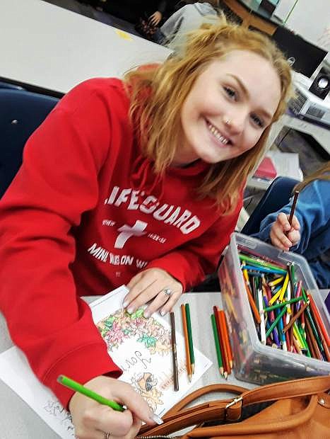Pioneer students put together food baskets for those in need for Thanksgiving.