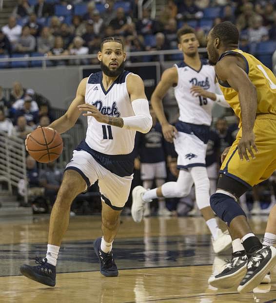 Nevada&#039;s Cody Martin (11) brings the ball up the floor against California Baptist in the first half in Reno, Nev., Monday.