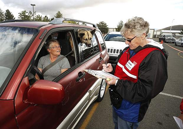 Trudi Gaye gets her flu shot during a drive-through Flu Shot Clinic in Carson City last month. The event, held by Carson City Health and Human Services in conjunction with a dozen local agencies, serves a point of distribution exercise to help the city be better prepared to handle emergencies. Photo by Cathleen Allison/Nevada Momentum