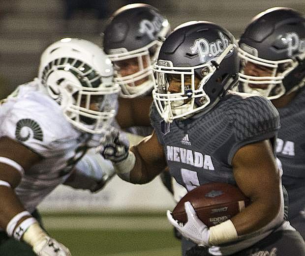Nevada running back Jaxson Kincaide (5) runs against Colorado State in the second half of an NCAA college football game in Reno, Nev., Saturday, Oct. 27, 2018. (AP Photo/Tom R. Smedes)