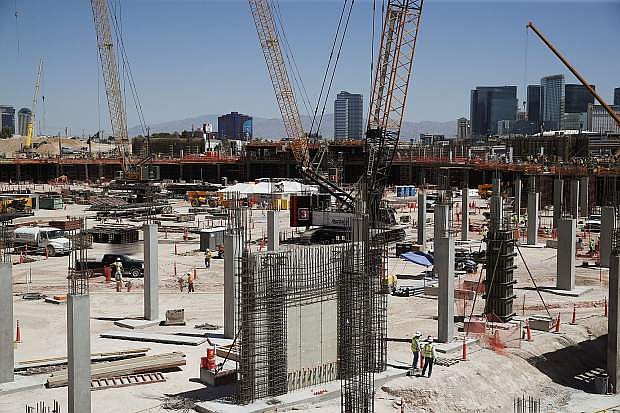 Workers continue construction on the future Raiders football stadium, Monday, June 11, 2018, in Las Vegas. (AP Photo/John Locher)