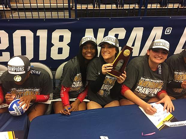 Natalie Anderson celebrates with her teammates after winning the national title.