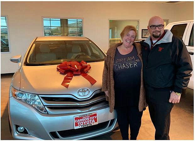 Tammy Hewlett, right, with Carson City Toyota representative Daniel Elliott after buying her new car. The dealership offered her a substantial discount after finding out her car had been stolen last month.
