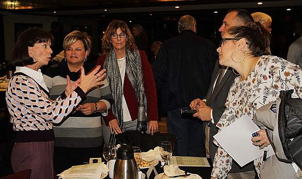 Assemblywoman Robin Titus, left, speaks to educators from Oasis Academy and Western Nevada College at the Jan. 9 CEDA breakfast.
