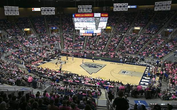 Players, coaches and fans wear pink as part of a &#039;Pinkout&#039; event at Lawlor Events Center in Reno on Wednesday to help support Coaches vs. Cancer Suits.