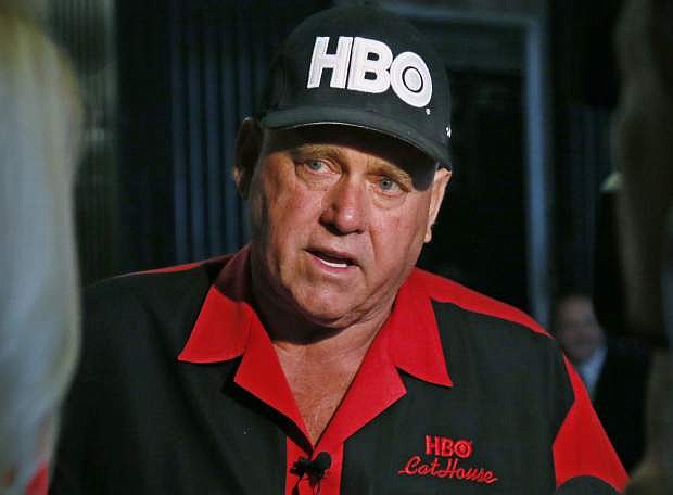 FILE - In this June 13, 2016, file photo, Dennis Hof, owner of the Moonlite BunnyRanch, a legal brothel near Carson City, Nev., is pictured during an interview during a break in the trial of Denny Edward Phillips and Russell Lee Hogshooter in Oklahoma City. Nevada authorities said Tuesday, Oct. 16, 2018, that Hof, a legal pimp who has fashioned himself as a Donald Trump-style Republican candidate has died. (AP Photo/Sue Ogrocki, File)