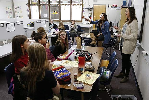 Diana Alonso, center, and Samantha Szoyka, right, with Partnership Carson City, lead a SOAR club meeting at Eagle Valley Middle School in Carson City, Nev., on Thursday, Jan. 10, 2019. The club, which stands for Students Offering Additional Resources, offers students service and other community-oriented activities as a means to remain drug and alcohol free. Photo by Cathleen Allison/Nevada Momentum