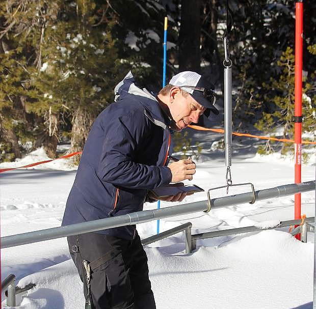 Natural Resources Conservation Service hydrologist Jeff Anderson measures the snowpack Wednesday at Mt. Rose Ski Tahoe.
