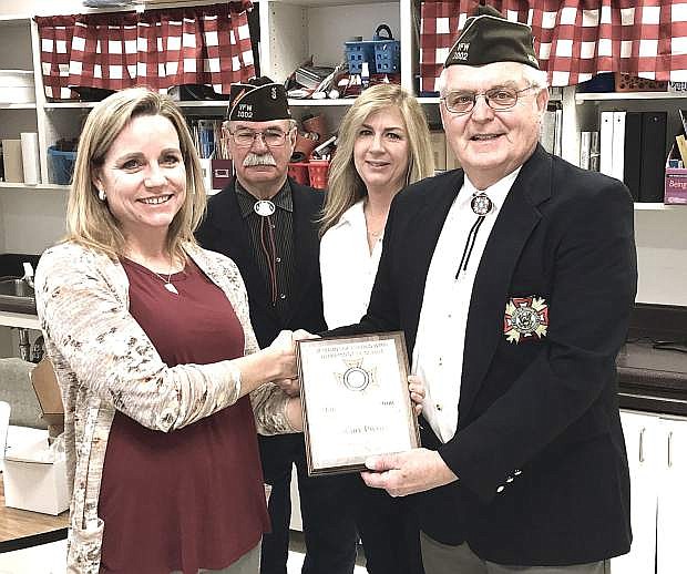 Richard MacLean, commander of the VFW Post 1002 in Fallon, recognizes VFW Teacher of the Year Tiffany Picotte, a fourth-grade teacher at Numa Elementary School. She will now compete for the national Teacher of the Year for elementary-school teachers. From left are Picotte Mike Terry and Melissa Nusi of VFW Post 1002 and MacLean.