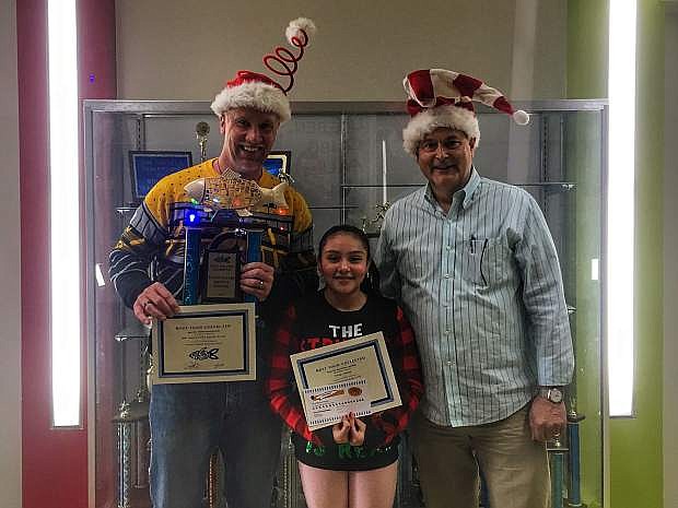 Eagle Valley Middle School principal Lee Conley, left, accompanied by EVMS seventh grader Vielka Lopez Munguia and FISH executive director Jim Peckham.