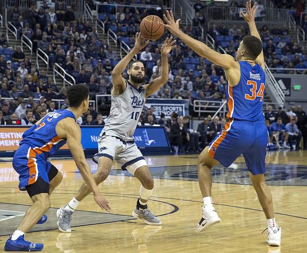 Nevada forward Cody Martin&#039;s (11) passes the ball in the first half on Saturday.
