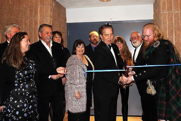 Mayor Robert Crowell is joined by Supervisors Lori Bagwell, Brad Bonkowski, John Barrette and former Supervisor Karen Abowd along with Parks Director Jennifer Budge, Chamber of Commerce Chair Bob Fredlund, and theater manager Eric Klug as the ribbon is cut to celebrate the grand re-opening of the Bob Boldrick Theater after the remodel.