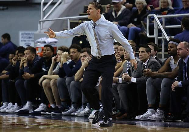 Nevada coach Eric Musselman argues a call with an official across the court.