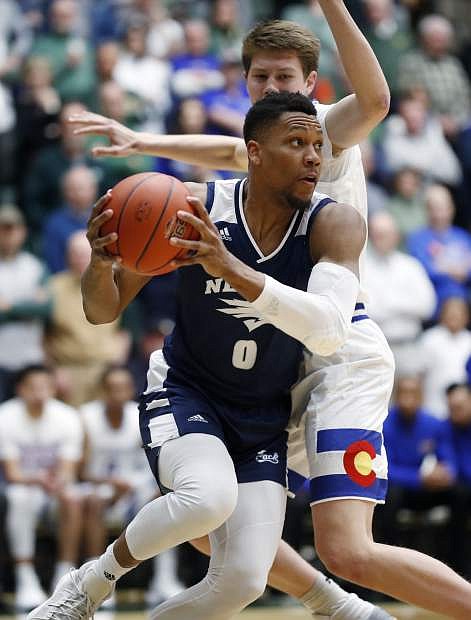 Nevada Wolf Pack forward Tre&#039;Shawn Thurman, front, drives past Colorado State Rams forward Adam Thistlewood during the first half of an NCAA college basketball game Wednesday, Feb. 6, 2019, in Fort Collins, Colo. (AP Photo/David Zalubowski)