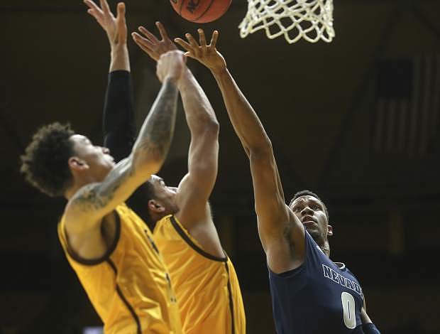 Nevada forward Tre&#039;Shawn Thurman (0) shoots during the first half of an NCAA college basketball game against Wyoming on Saturday, Feb. 16, 2019, in Laramie, Wyo. (AP Photo/Jacob Byk)