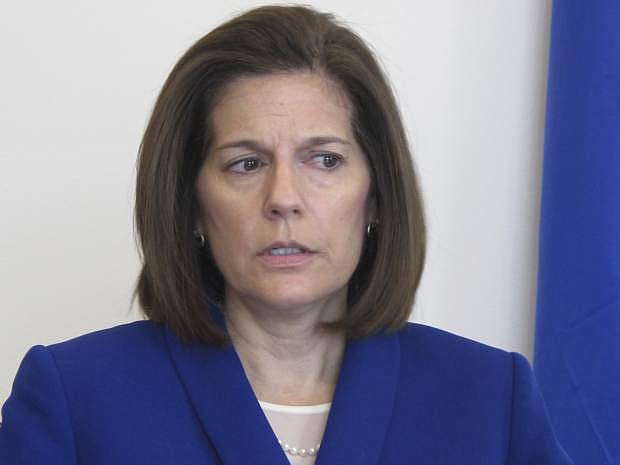 FILE - In this Jan. 11, 2019 file photo, Sen. Catherine Cortez Masto, D-Nev., talks to reporters in her office in Reno, Nev. Sen. Catherine Cortez Masto says Energy Secretary Rick Perry has committed to expediting the removal of weapons-grade plutonium it secretly shipped to a site in Nevada last year if she agrees to stop blocking appointments to vacant positions in his department. (AP Photo/Scott Sonner, File)