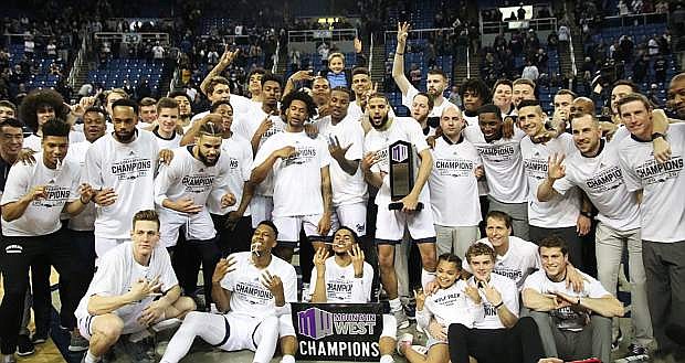 The Wolf Pack celebrate Saturday night after beating San Diego State to be co-champions of the Mountain West Conference with Utah State.