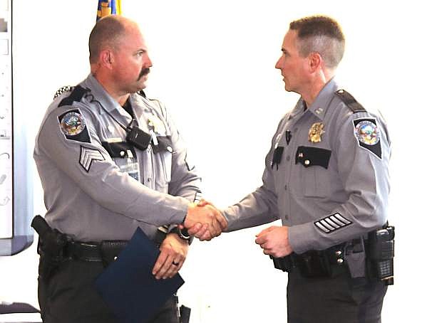 Lt. Blair Harkleroad, right, congratulates Sgt. Chris Kelly, a 1991 Churchill County High School graduate of receiving the Investigation of the Year award.