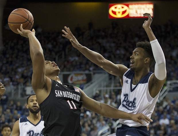 San Diego State forward Matt Mitchell is guarded by Nevada forward Jordan Brown during Saturday&#039;s game in Reno.