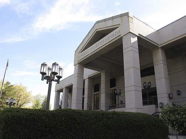 Nevada Supreme Court takes up public employee lawmakers case Serving