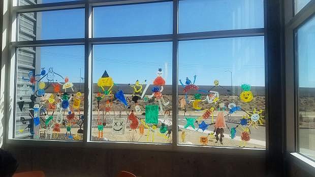 Window mural painted by Boys &amp; Girls Clubs of Western Nevada Teen Center members and visiting artist Zet Gold.