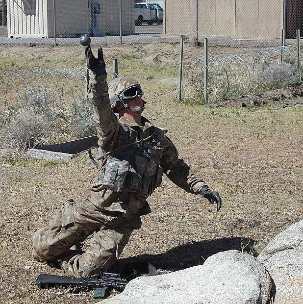 In this file photo from the 2017 Nevada Guard Best Warrior contest, a Nevada Guard soldier tosses a mock grenade for distance and accuracy. The annual Best Warrior contest tests guardsmen in a variety of combat skills. This year, Tongan Marines are participating in the event in Hawthorne.