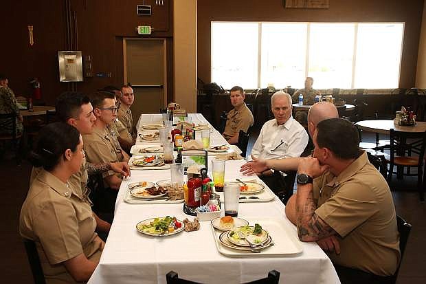 190424-N-UT455-1011 NAVAL AIR STATION FALLON, Nev. (April 24, 2019) Secretary of the Navy (SECNAV) Richard V. Spencer takes a question from Personnel Specialist 2nd Class Charles Emmert while eating lunch with Sailors aboard Naval Air Station Fallon, Nev. Spencer is in the area for a brief tour of the Naval base and the Fallon Range Training Complex. (U.S. Navy photo by Mass Communication Specialist 1st Class Larry S. Carlson)
