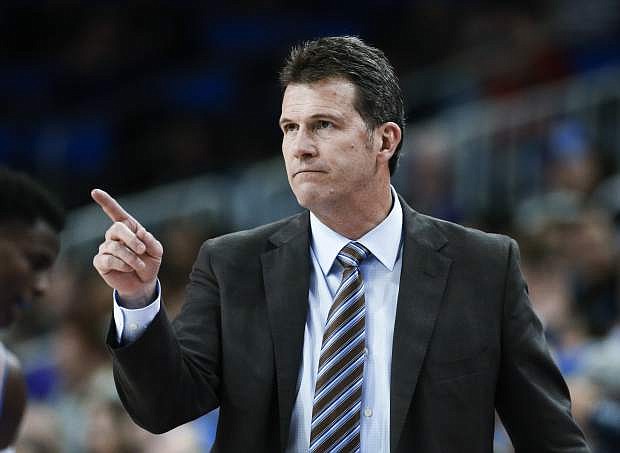 FILE - In this Dec. 31, 2017, file photo, UCLA coach Steve Alford gestures during the team&#039;s NCAA college basketball game against Washington in Los Angeles. Nevada hired former UCLA coach Alford on Thursday April 11, 2019, four days after Eric Musselman left for Arkansas. Alford is expected to be introduced at a Friday news conference. (AP Photo/Ringo H.W. Chiu, File)