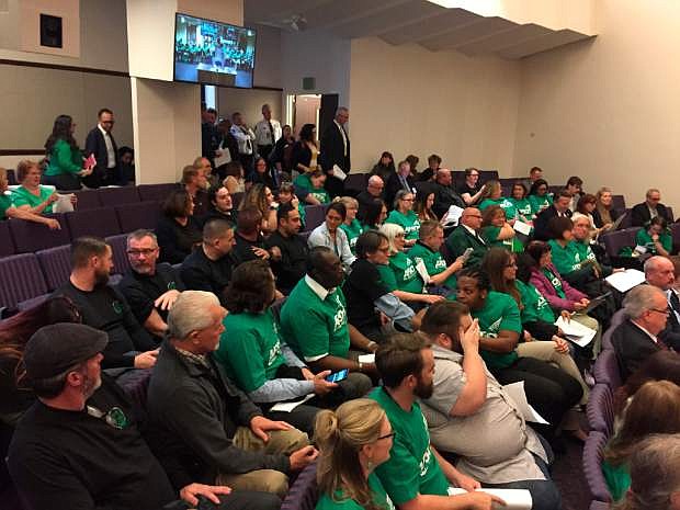 A crowd gathers before a hearing with Nevada lawmakers on a bill that would allow state workers to collectively bargain Thursday, April 4, 2019, in Carson City, Nev. The hearing drew dozens of people to the legislative building. The measure seeks to allow state workers the right to bargain collectively over wages, hours and other employment conditions. (AP Photo/Ryan Tarinelli)