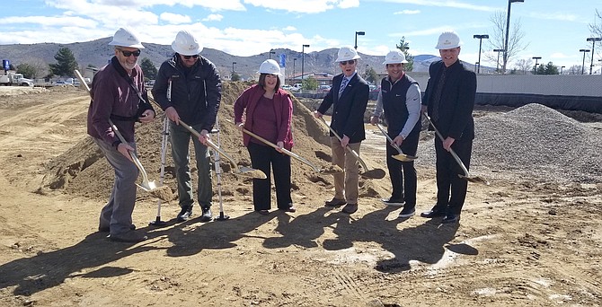 Mayor Bob Crowell, Supervisor Lori Bagwell, Chris Russell, and Bill Miles, Miles Construction throw dirt on 4-acre site of future Carson City Nissan dealership. Russell, the dealership&#039;s owner, said the 25,000 square foot dealership on South Carson Street will open Nov. 1.