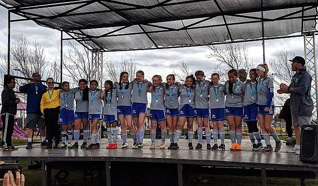 The Carson Football Club Evolution won the title in the U-14 girls division in the Comstock Shootout.