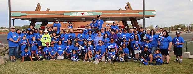 Walkers take their annual photo at Fox Peak after completing a walk to recognize Child Abuse Prevent Month.