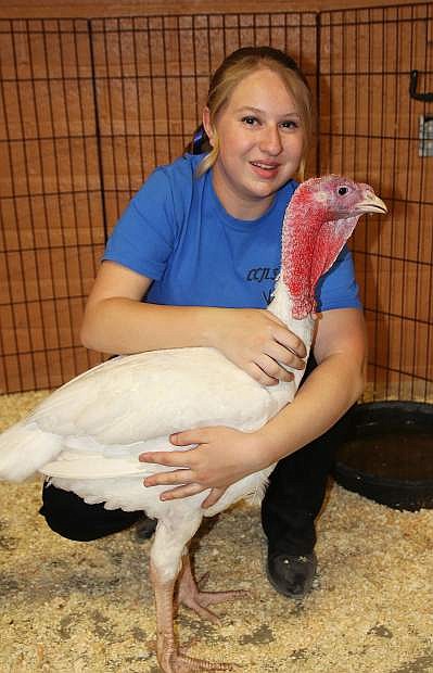 FFA student AG Natasha Emke poses with her turkey on the second day of the show.